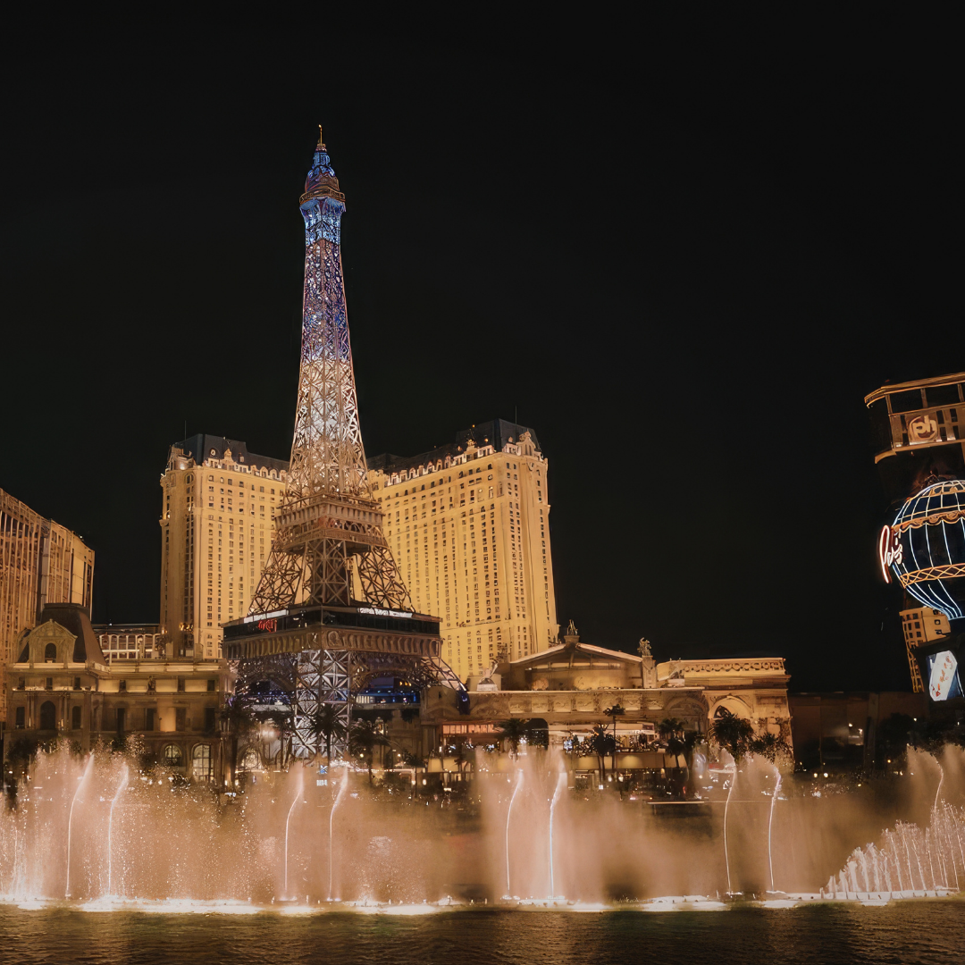 Bellagio fountains and Paris Las Vegas at night